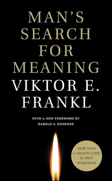 Book cover of "Man's Search for Meaning" by Viktor E. Frankl, featuring bold white text on a black background with a single glowing candle flame below.