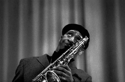 Black and white image of Sonny Rollins playing his Tenor Saxophone.